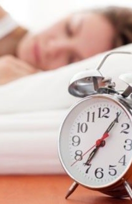 sleeping woman with clock
